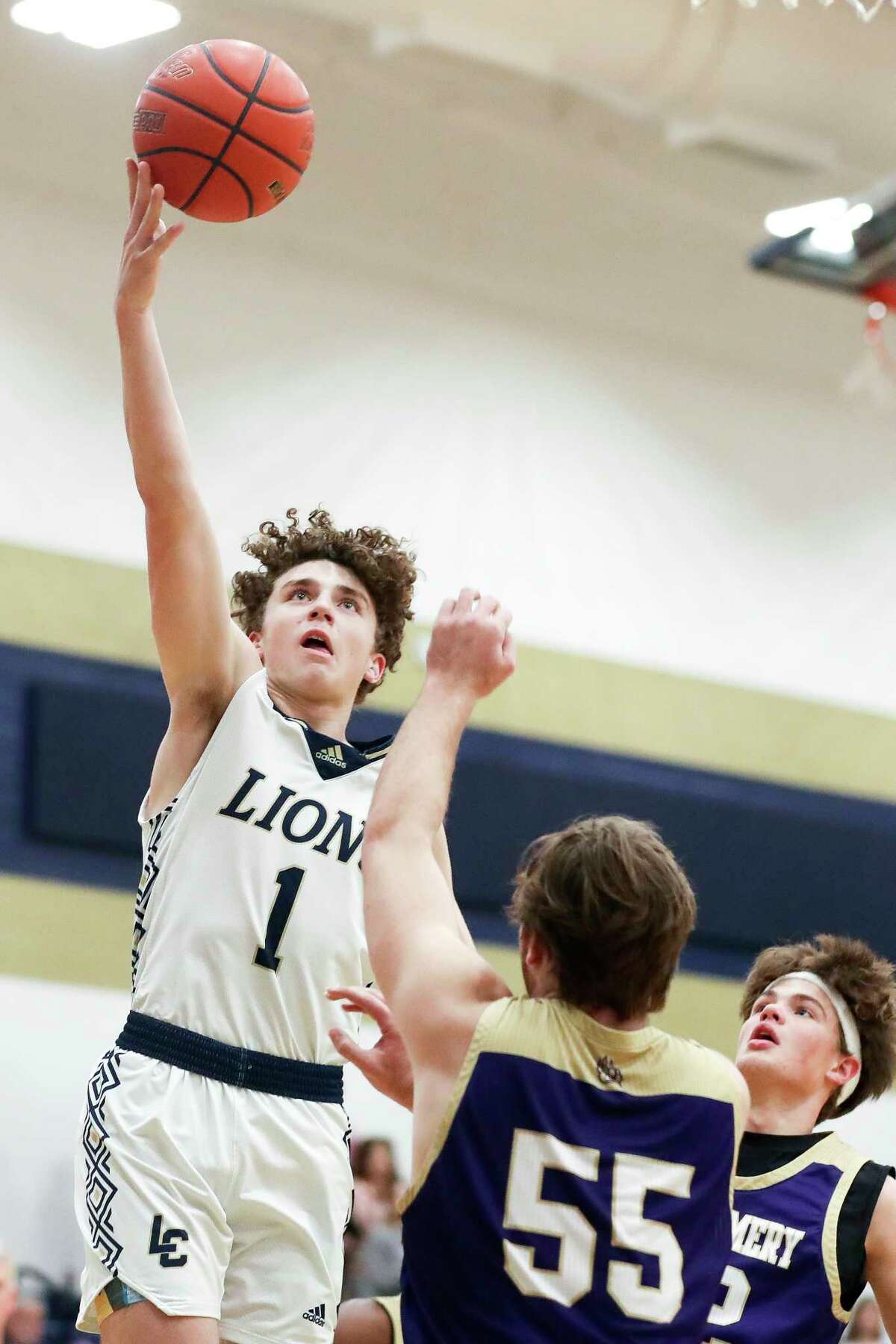 Lake Creek shooting guard Jett Sutton (1) shoots over Montgomery center Isaak Nelson (55) in the second quarter of a District 21-5A high school basketball game at Lake Creek High School, Friday, Jan. 20, 2023, in Montgomery.