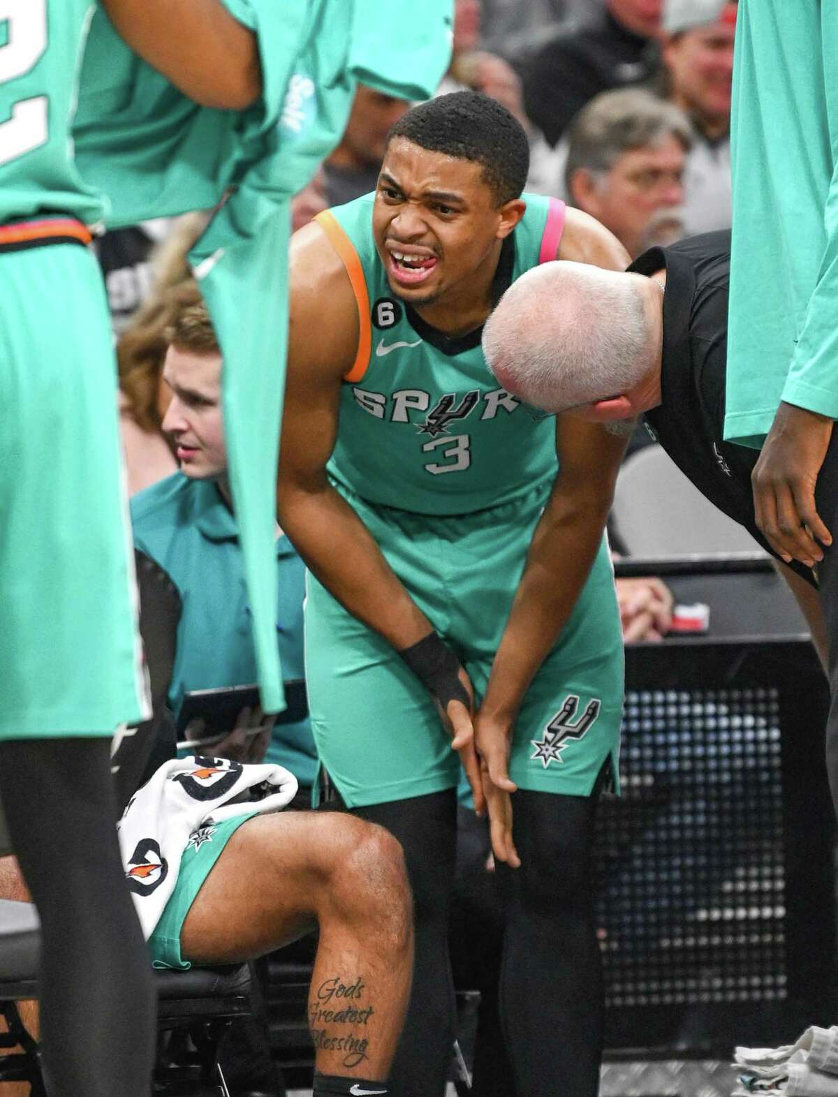 Keldon Johnson of the Spurs grimaces as he rubs his hands together after hurting one of them during NBA action against the Los Angeles Clippers in the AT&T Center on Friday, Jan. 20, 2023.