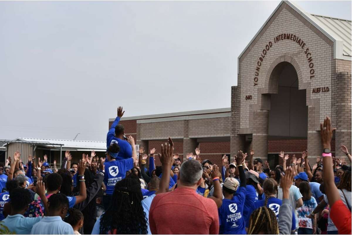 Nearly 400 people showed up at Alief Youngblood Intermediate School to help with a school beautification project.