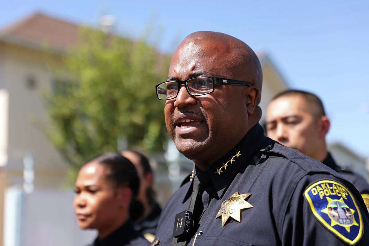 Suspended Oakland Police Chief LeRonne Armstrong shown speaking at the scene of a fatal shooting on the 2000 block of 13th Avenue in July, 2022. The police department’s troubled history spans more than 20 years and nearly a dozen police chiefs over the same period.