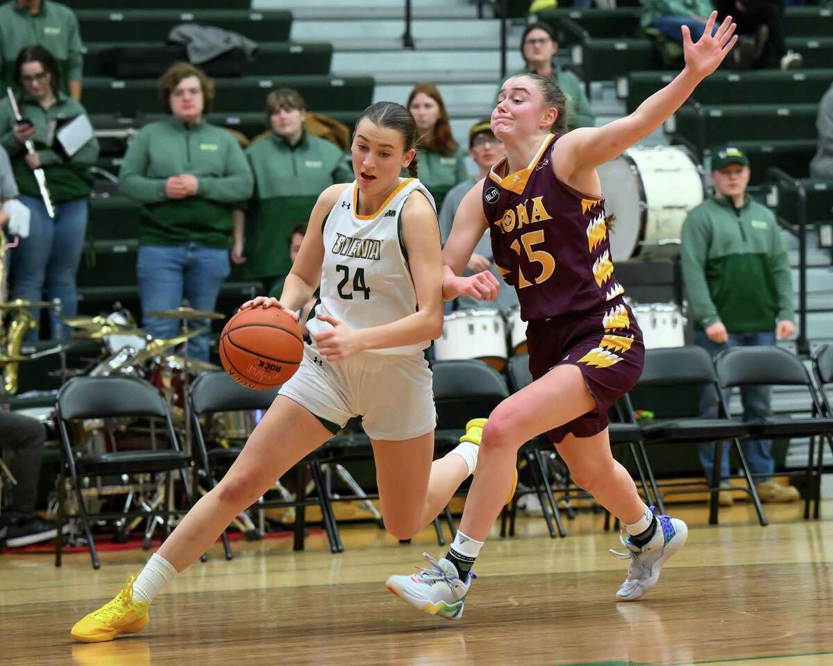 Siena freshman Elisa Mevius drives to the basket in front of Iona defender Kate Mager on Saturday, Jan. 21, 2023, at the UHY Center on the Siena campus in Colonie, NY.