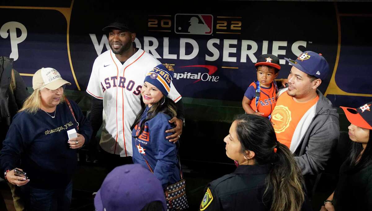 Houston Astros Yordan Alvarez takes photos with fans in the dugout during the Astros FanFest at Minute Maid Park on Saturday, Jan. 21, 2023 in Houston.