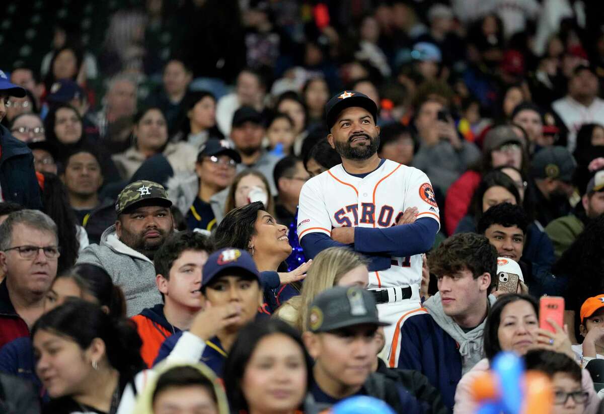 Jose Gamboa, a dead-ringer for Jose Altuve, stands to listen to Jose Altuve and Alex Bregman during a fan forum during the Astros FanFest at Minute Maid Park on Saturday, Jan. 21, 2023 in Houston.