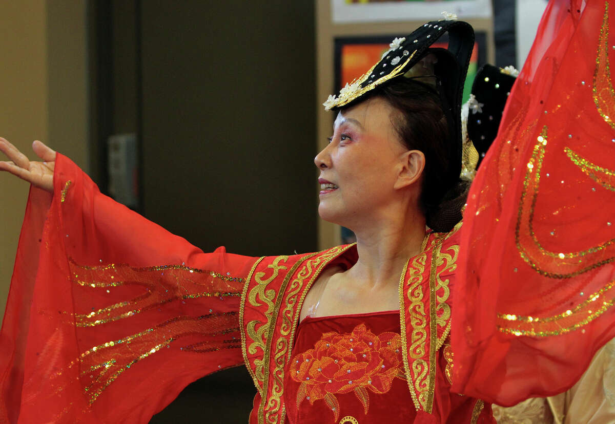 Alison Wang, with the Connecticut Chinese Dance group, performs Qingping Melody during a program celebrating the year of the rabbit in the Lunar New Year at Cos Cob Library in Greenwich, Conn., on Saturday January 21, 2023. In addition to the dance program, activities also included a New Year craft workshop for the kids and a Mandarin storytime from the Chinese Language School of Connecticut.