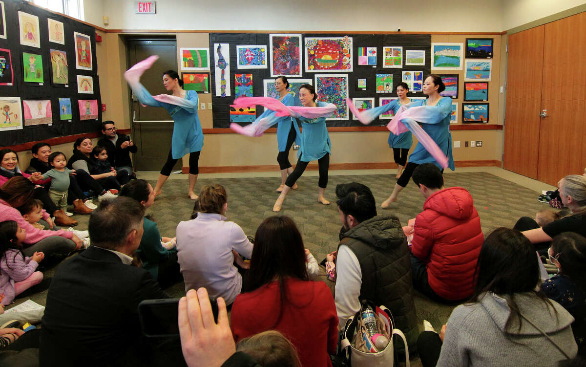 Members of the Connecticut Chinese Dance group perform the Calligraphy Dance during a program celebrating the year of the rabbit in the Lunar New Year at Cos Cob Library in Greenwich, Conn., on Saturday January 21, 2023. In addition to the dance program, activities also included a New Year craft workshop for the kids and a Mandarin storytime from the Chinese Language School of Connecticut.