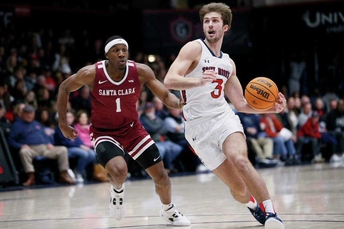 St. Mary's Gaels guard Augustas Marciulionis (3) drives to the hoop against Santa Clara Broncos guard Carlos Stewart (1) in the first half during a men’s basketball game at University Credit Union Pavilion in Moraga, Calif., Saturday, Jan. 21, 2023.