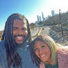 Edwardsville graduate David Young and his wife, Charity, on the bridge over the highway at Millennium Park in Chicago.