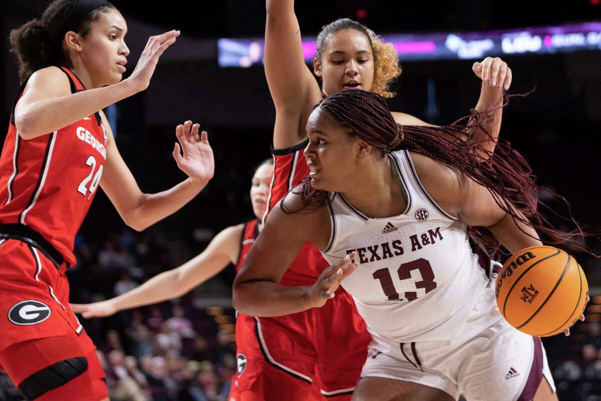 Texas A&M's forward Jada Malone (13) works her way down the baseline in the first half of an NCAA college basketball game against Georgia in College Station, Texas, Sunday, Jan. 22, 2023. (Logan Hannigan-Downs/College Station Eagle via AP)