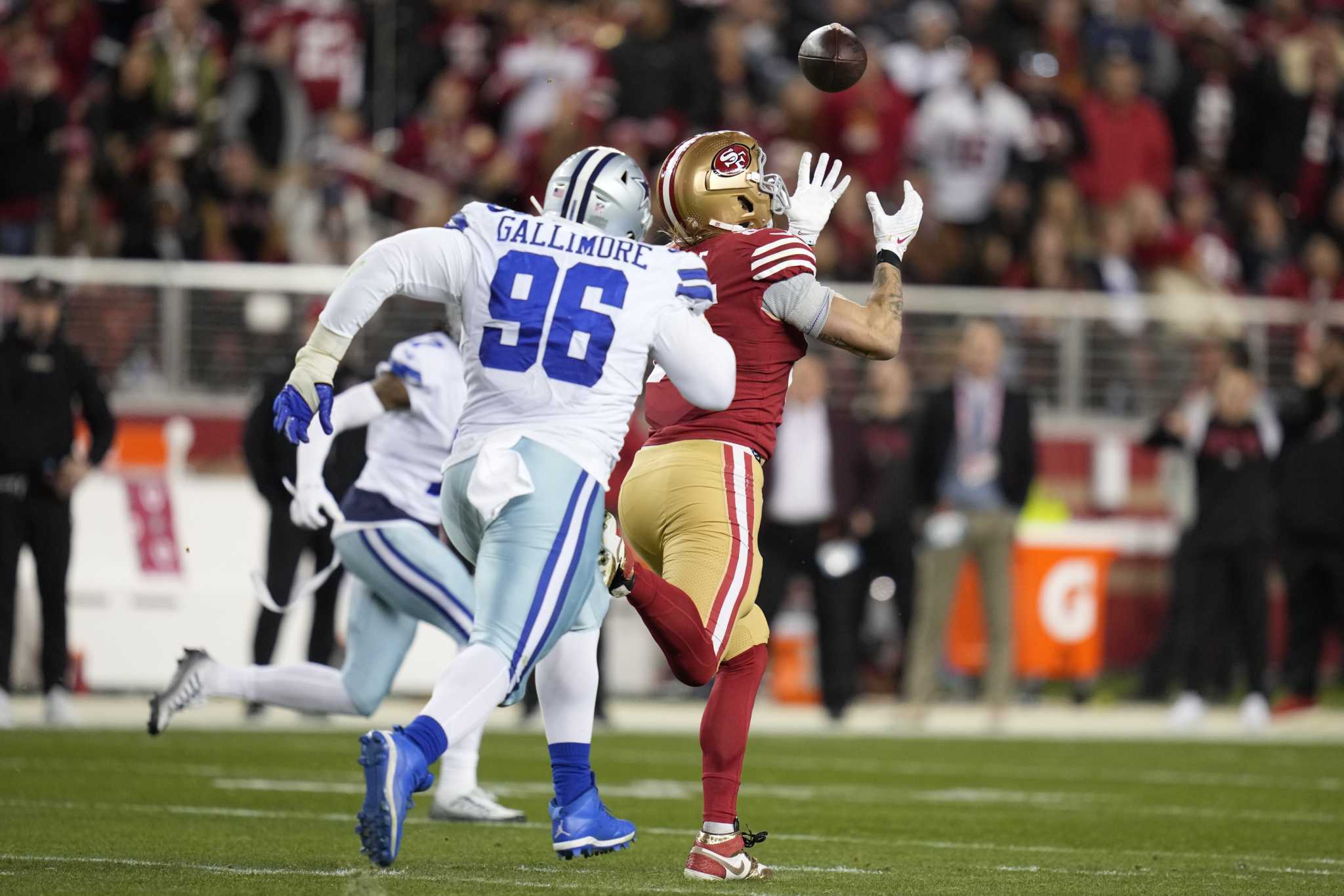 San Francisco 49ers quarterback Brock Purdy (13) runs against Dallas Cowboys  defensive end Dorance Armstrong (92) during the second half of an NFL  divisional round playoff football game in Santa Clara, Calif.