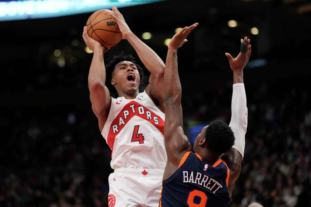 Raptors forward Scottie Barnes shoots over Knicks guard RJ Barrett during Toronto’s home win.