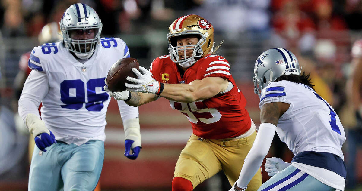 George Kittle (85) makes a catch after bobbling the ball briefly In the second half as the San Francisco 49ers played the Dallas Cowboys in the divisional round of the NFL Playoffs at Levi's Stadium in Santa Clara, Calif., on Sunday, January 22, 2023.