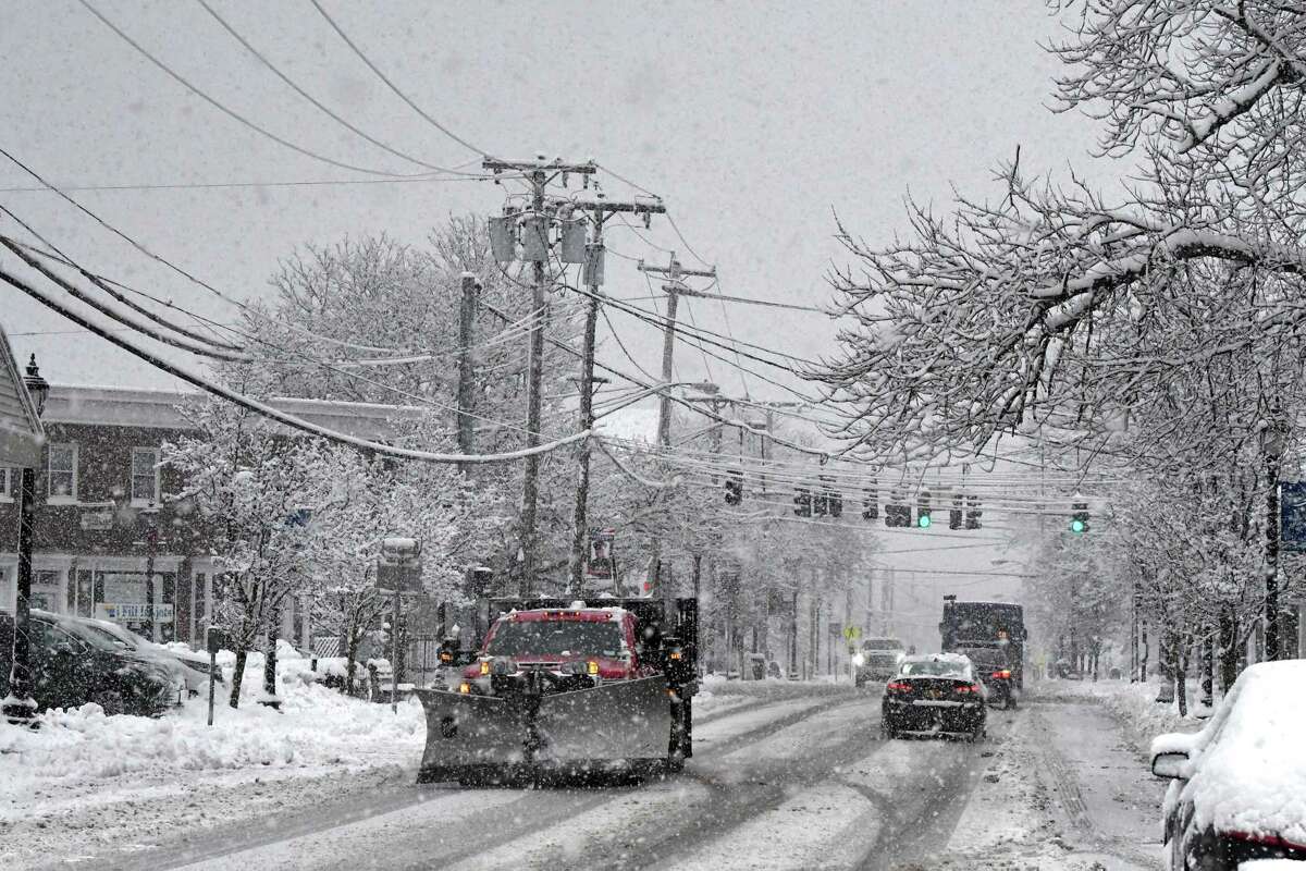 A thick layer of snow blankets the Four Corners on Delaware Ave. on Monday, Jan. 23, 2023, in Delmar, N.Y.