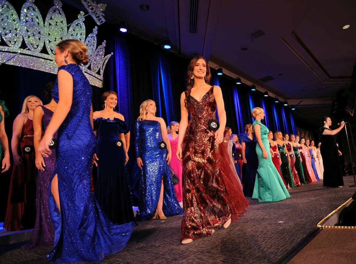 Miss Madison County Fair Johna Murphy, center, parades across the stage with other contestants during the 2023 Miss Illinois County Fair Queen Pageant.
