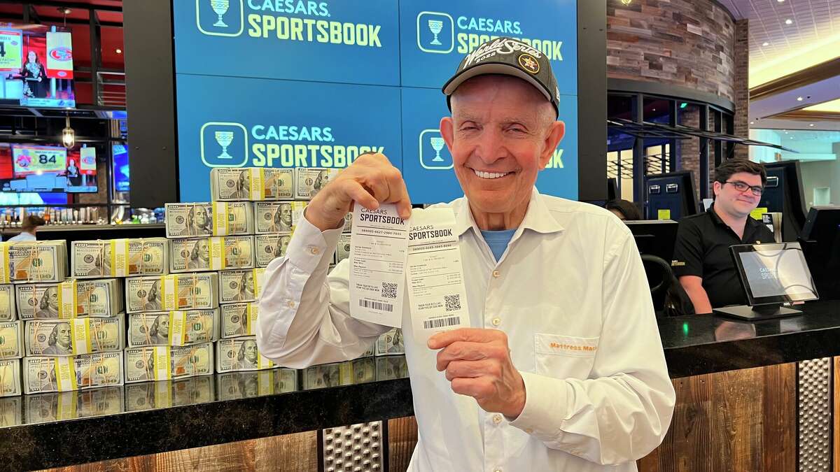 Jim "Mattress Mack" McIngvale holds his betting slips after betting $2 million on the Cowboys to beat the 49ers in the NFL playoffs on Sunday, Jan. 22, 2023. McIngvale said he is against a bill to legalize mobile sports betting in Texas.