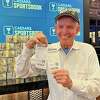 Jim "Mattress Mack" McIngvale holds his betting slips after betting $2 million on the Cowboys to beat the 49ers in the NFL playoffs on Sunday, Jan. 22, 2023.