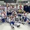 The Darien Pee Wee A team takes a team photo with the championship plaque and their medals after winning a Can/Am tournament in Annapolis, MD, recently. From left, front row, Robbie Squillaro, Hunter Houston, Hagan Fiordalis, Jonathan Veeder, Chase, Larsen, Charlie Bellissimo, Cole Morgan, and Alex Blake; back row, Will Janne, Nate Barrett, Henry Muecke, head coach Buzz Olson, Brady Woodward, Hale Golec, Colin Dowling, Andrew Sedlarcik, Luke Amen, Joseph Felice, and Assistant Coaches John O'Neill and John Golec.