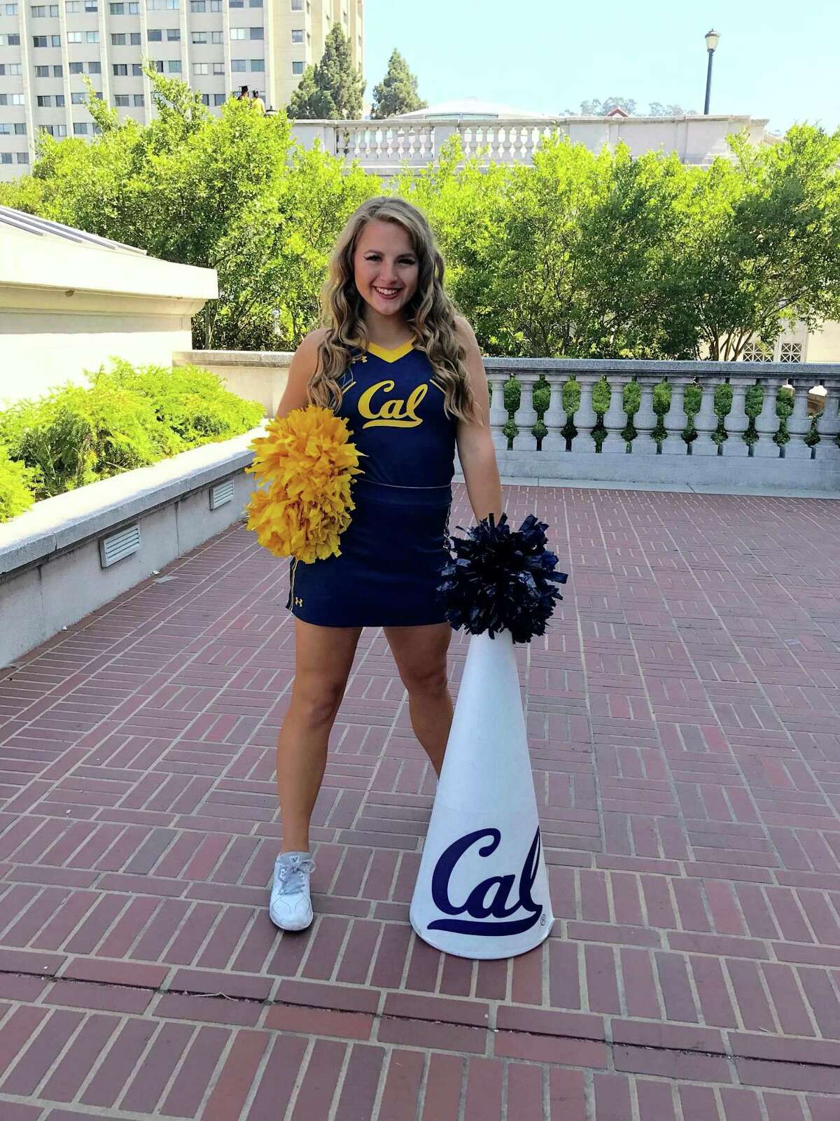 Former UC Berkeley cheerleader Melissa Martin sued the university over claims she was told to continue performing despite suffering concussions.