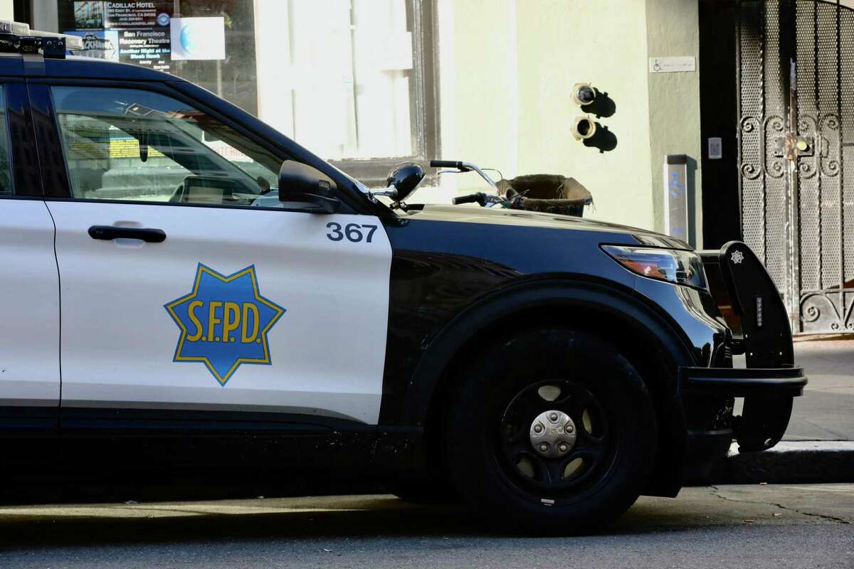 A San Francisco Police Department vehicle is parked near the Tenderloin Station in San Francisco, California, Saturday, January 21, 2023.