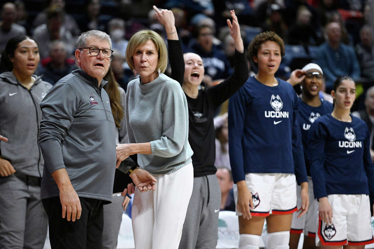 UConn head coach Geno Auriemma, front left, is held back by associate head coach Chris Dailey while questioning an official in the first half of an NCAA college basketball game against DePaul, Monday, Jan. 23, 2023, in Storrs, Conn. (AP Photo/Jessica Hill)