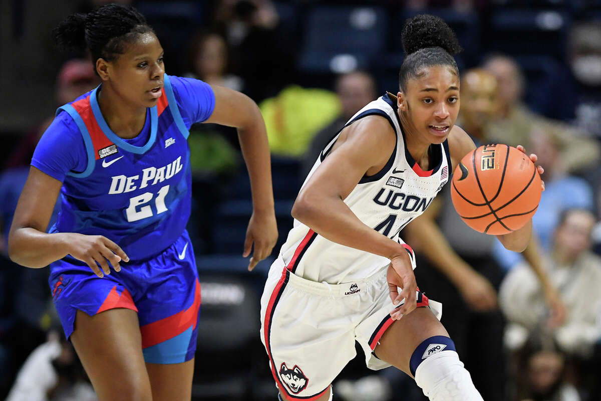 UConn's Aubrey Griffin, right, steals the ball from DePaul's Darrione Rogers in the first half of an NCAA college basketball game, Monday, Jan. 23, 2023, in Storrs, Conn. (AP Photo/Jessica Hill)