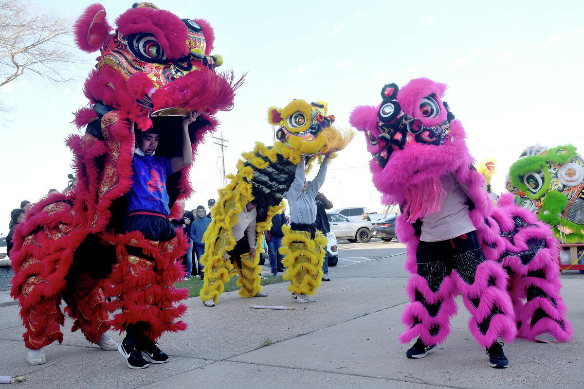 The Flaming Lion Dancers perform at the Port Arthur Public Library, helping celebrate the Lunar New Year and 2023 as the "Year of the Rabbit." Photo made Monday, January 23, 2023 Kim Brent/Beaumont Enterprise