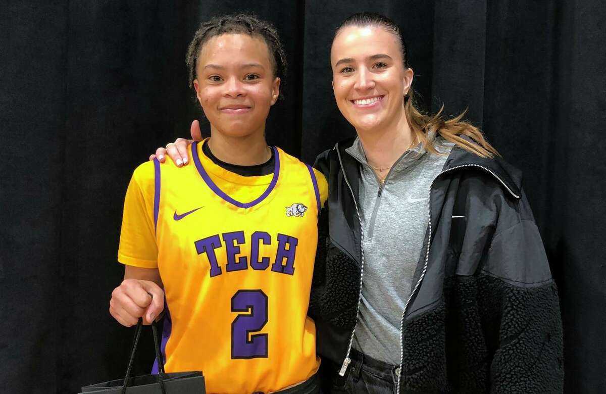 Sabrina Ionescu poses with Oakland Tech's Taliyah Logwood, who was named MVP of her team's 72-50 win over Heritage-Brentwood at Saturday's #SI20Showcase. Logwood had a triple double with 37 points, 13 rebounds and 11 steals.