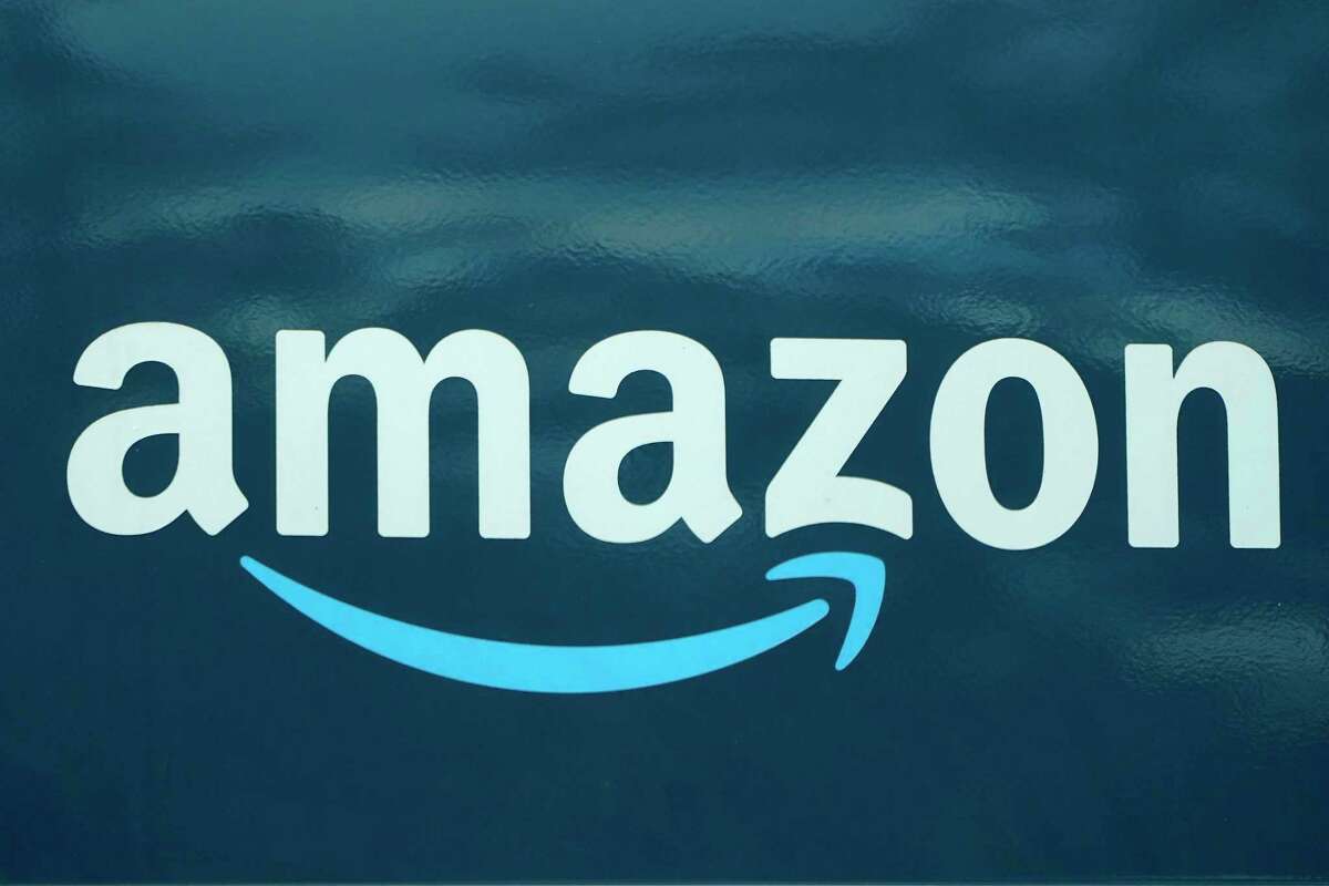 FILE - An Amazon logo appears on a delivery van, Oct. 1, 2020, in Boston. Amazon is adding a prescription drug discount program to its growing health care business. The retail giant said Tuesday that it will launch RxPass, a subscription service for customers who have Prime memberships.