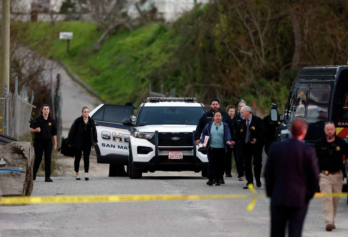 San Mateo County Sheriffs and EMS walk down a road near the scene of a nearby mass shooting that left 4 people dead near Highway 92 in Half Moon Bay, Calif., on Monday, January 23, 2023.
