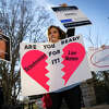 Penny Harrison and her son Parker Harrison rally against the live entertainment ticket industry outside the U.S. Capitol January 24, 2023 in Washington, DC. The Senate Judiciary Committee is holding a hearing this morning to explore whether the merger of Live Nation and Ticketmaster has stifled competition and harmed the consumer marketplace. 