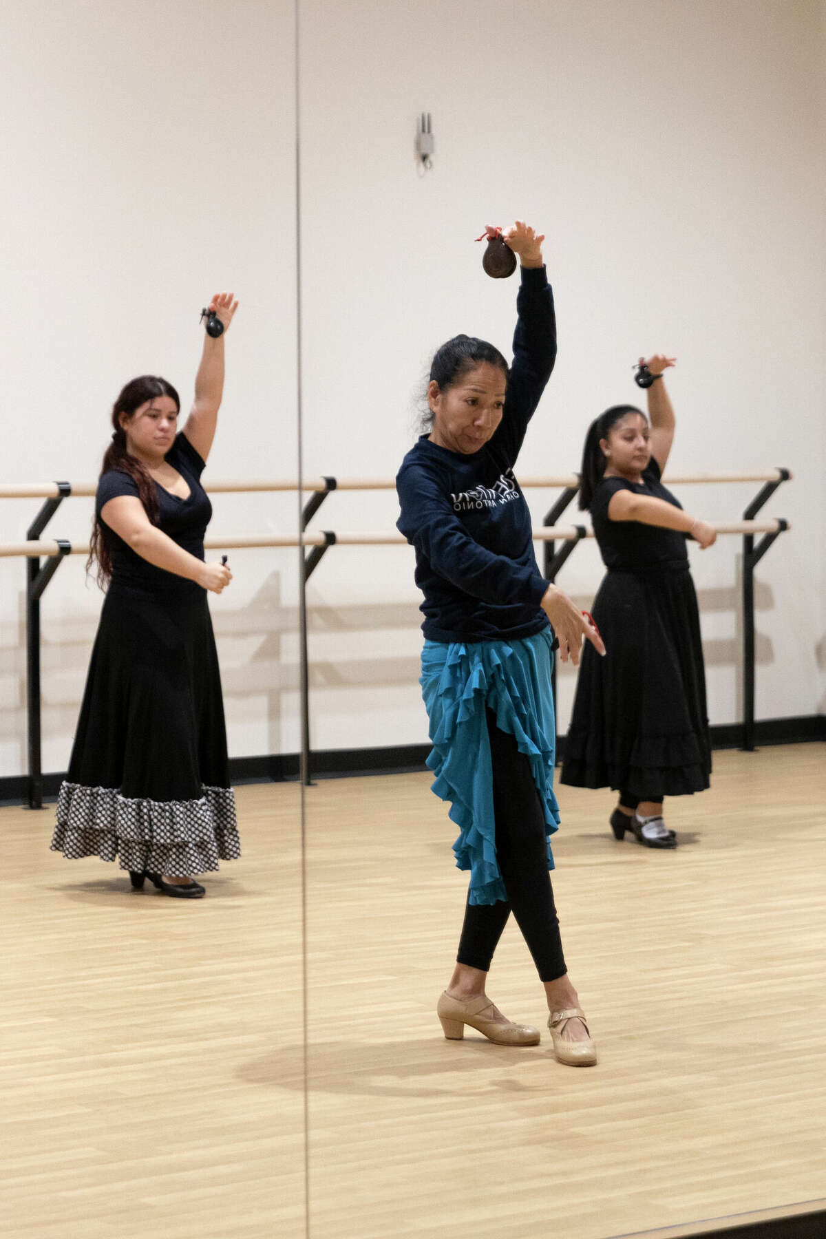 Sonya Casillas teaches an intermediate castanets dance class to Trinity Ajuntas, 17, and Anailla Zuniga, 14, at the Berta Almaguer Dance Studio & Community Center.
