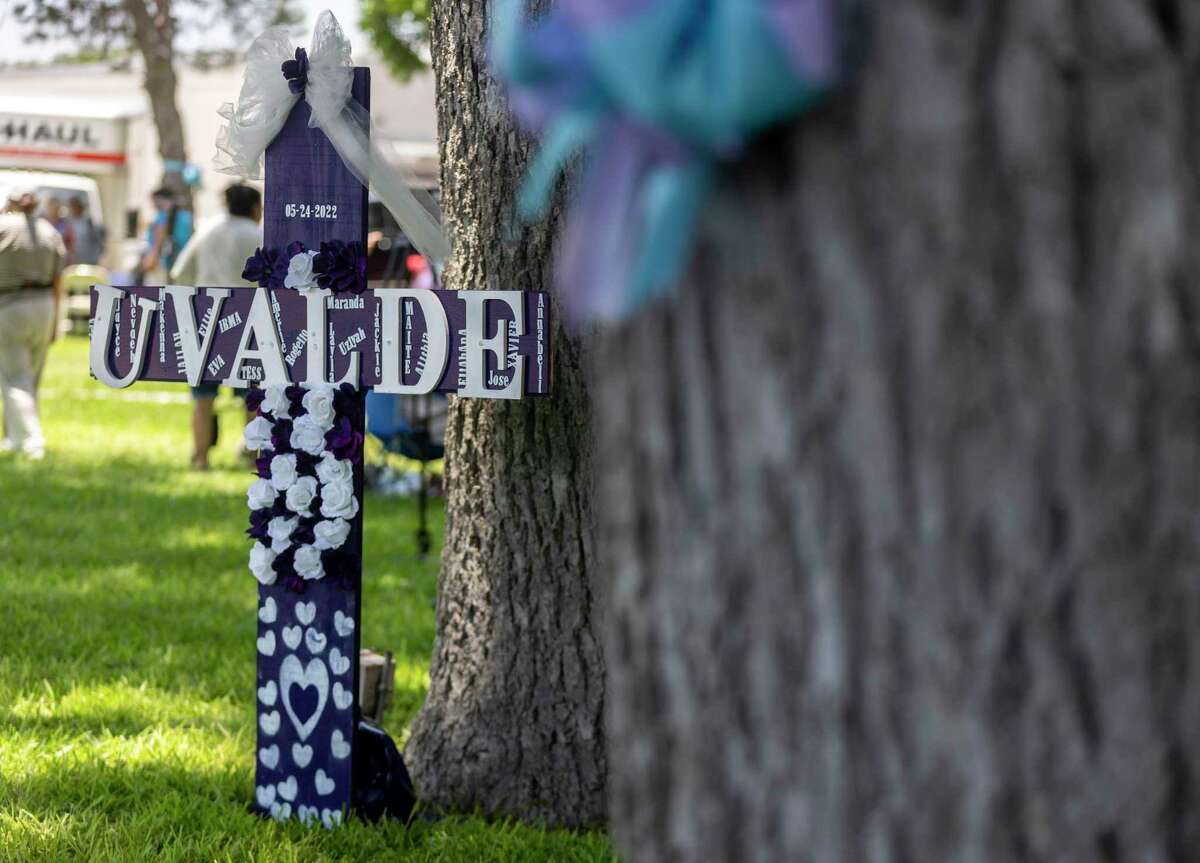 A cross stands in the Uvalde Town Square last year, bearing the names of those killed days earlier in the mass shooting at Robb Elementary School on May 24.
