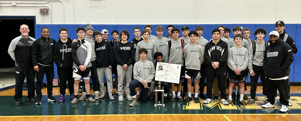 The Xavier wrestlers won the Coilton Abely Tournament at Mercy High School on Jan. 21, 2023.