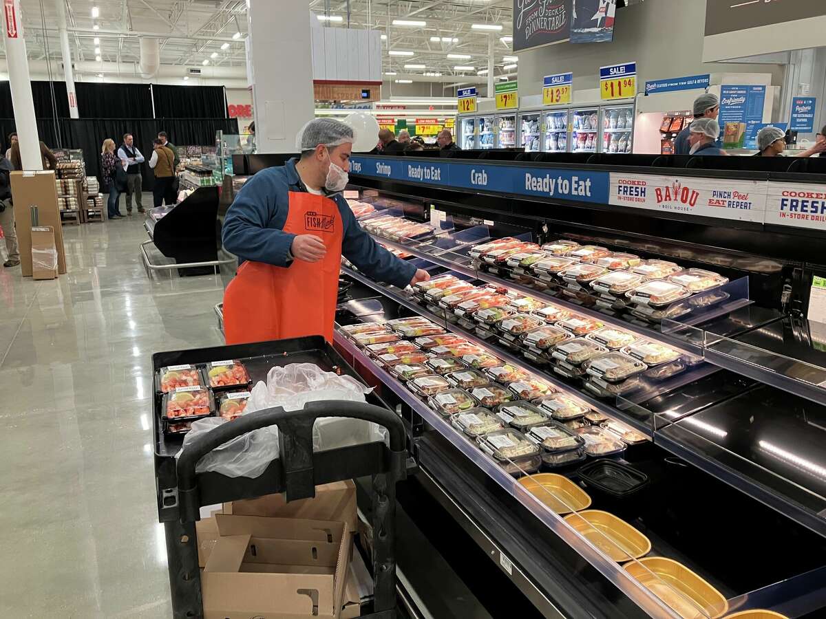 Workers stocking the store before the grand opening.