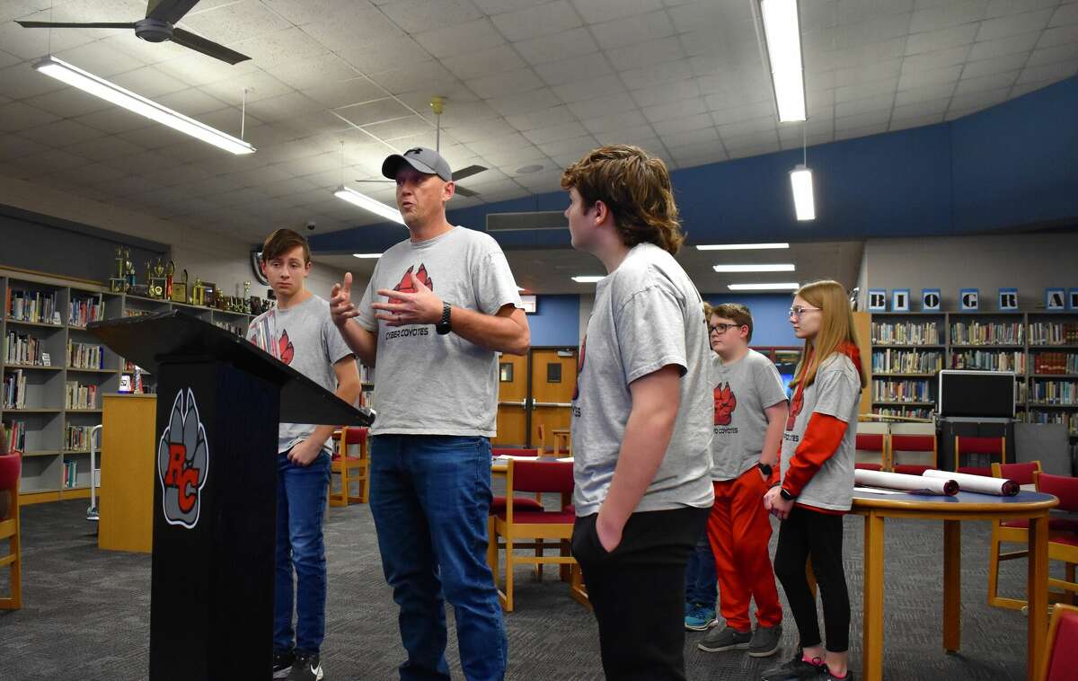 The Reed City Area Public Schools board of education took time to recognize the accomplishments of the middle school robotics program and heard from head coach Josh Johnson (pictured center).