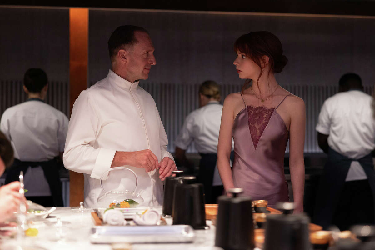 Ralph Fiennes, left, and Anya Taylor-Joy in "The Menu." (Eric Zachanowich/Searchlight Pictures/20th Century Studios/TNS)