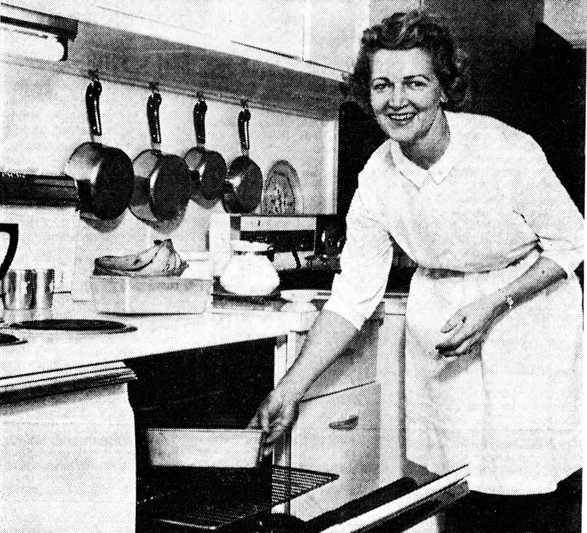Mrs. Rupert Stephens, 500 Eighth St., puts in her ham loaf in the oven. The loaf is suitable for a hearty family dinner or when dressed up with a fancy salad and other trimmings makes an ideal buffer supper dish for company. Stephens was featured in the News Advocate's Cooking with Our Best column published on Jan. 31, 1963.