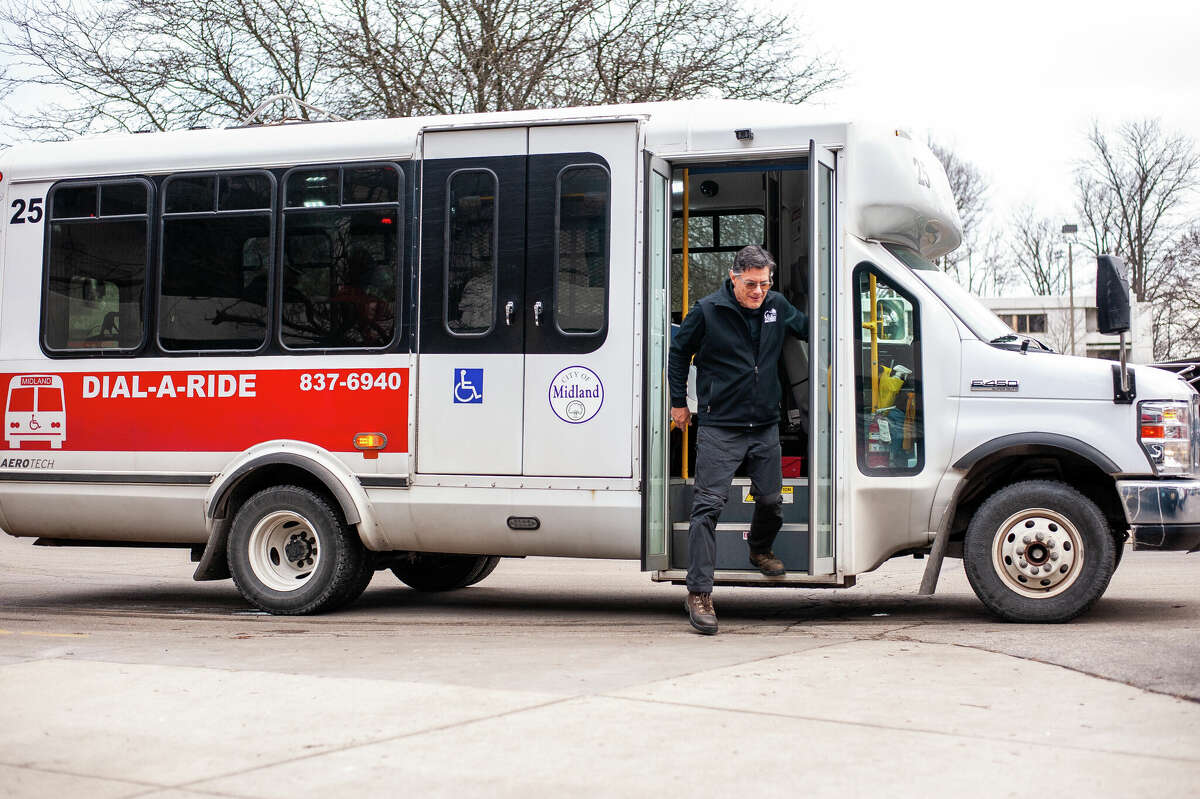 Dial-a-Ride driver Michael Dorrien steps off his bus on Jan. 24, 2023 at Washington Woods in Midland.