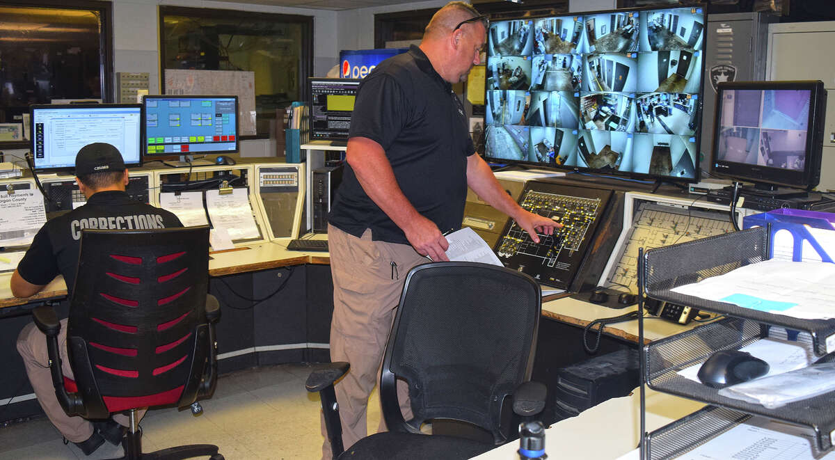 Sheriff Mike Carmody looks over monitors in the communications center of the Morgan County Adult Detention Facility. The county has approved more than $1.2 million in upgrades for the facility.