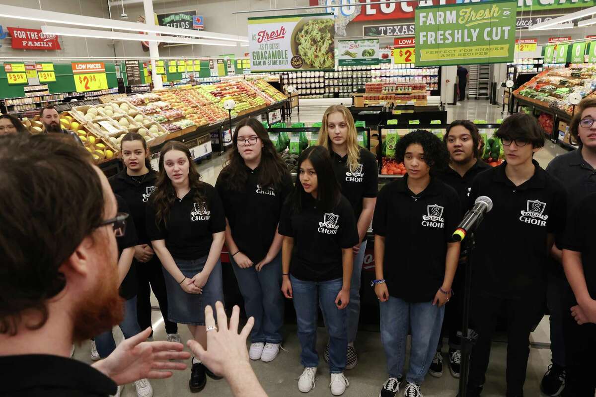 The Steele High School choir sings the National Anthem during a ribbon cutting and tour of the new Cibolo H-E-B, Tuesday, Jan. 24, 2023. The 110,000 square-foot store is schedule to open to the public on Wednesday.