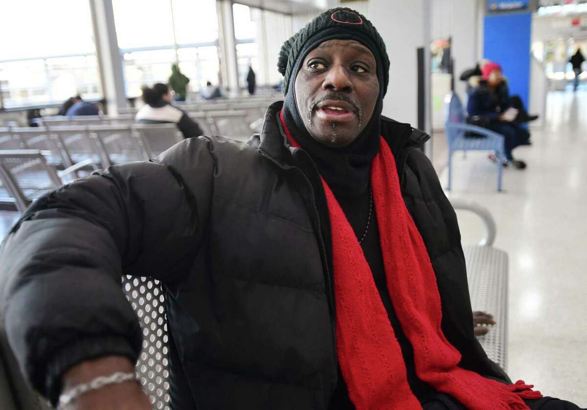 Jeff Blackman, of Bridgeport, spends his days in the warmth of the train station in Bridgeport, Conn. on Tuesday, Jan. 24, 2023. Blackman said he prefers the station because it helps him avoid the triggers on the street and in the neighborhoods that could lead him back into drug use.