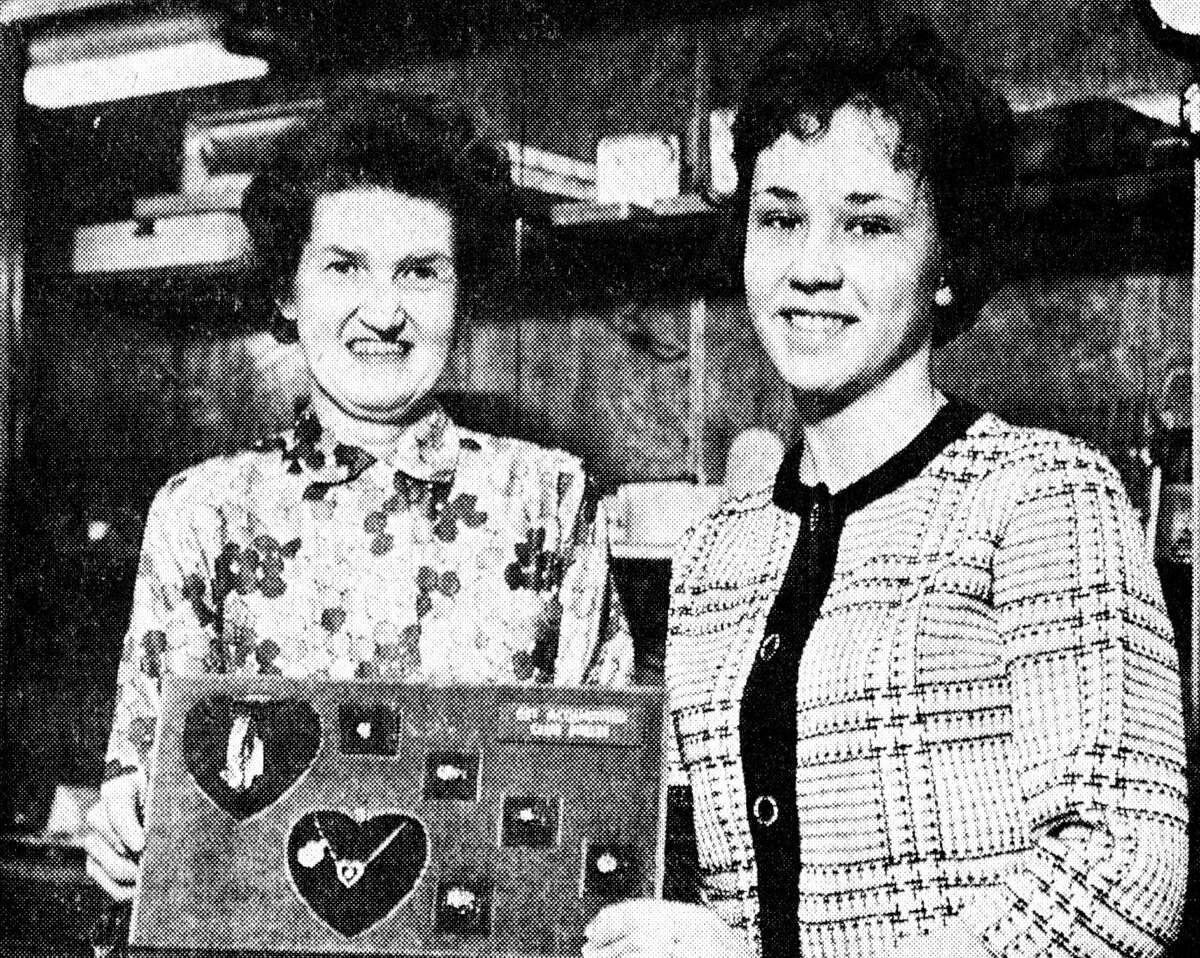 (From left) Frances Buffin and Nancy Tabaczka admire a selection of gifts which may be won in Closson's Get-Acquainted Club. Tabaczka is the first winner in the current club and Buffin drew Tabacka's winning ticket. The photo was published in the News Advocate on Feb. 1, 1963.