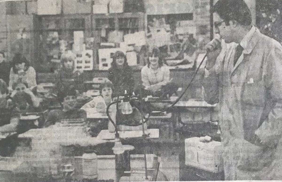 Greg Socha of The Dow Chemical Co., demonstrates the proper use of chemicals and some "chemical magic" to seventh grade science students. February 1984