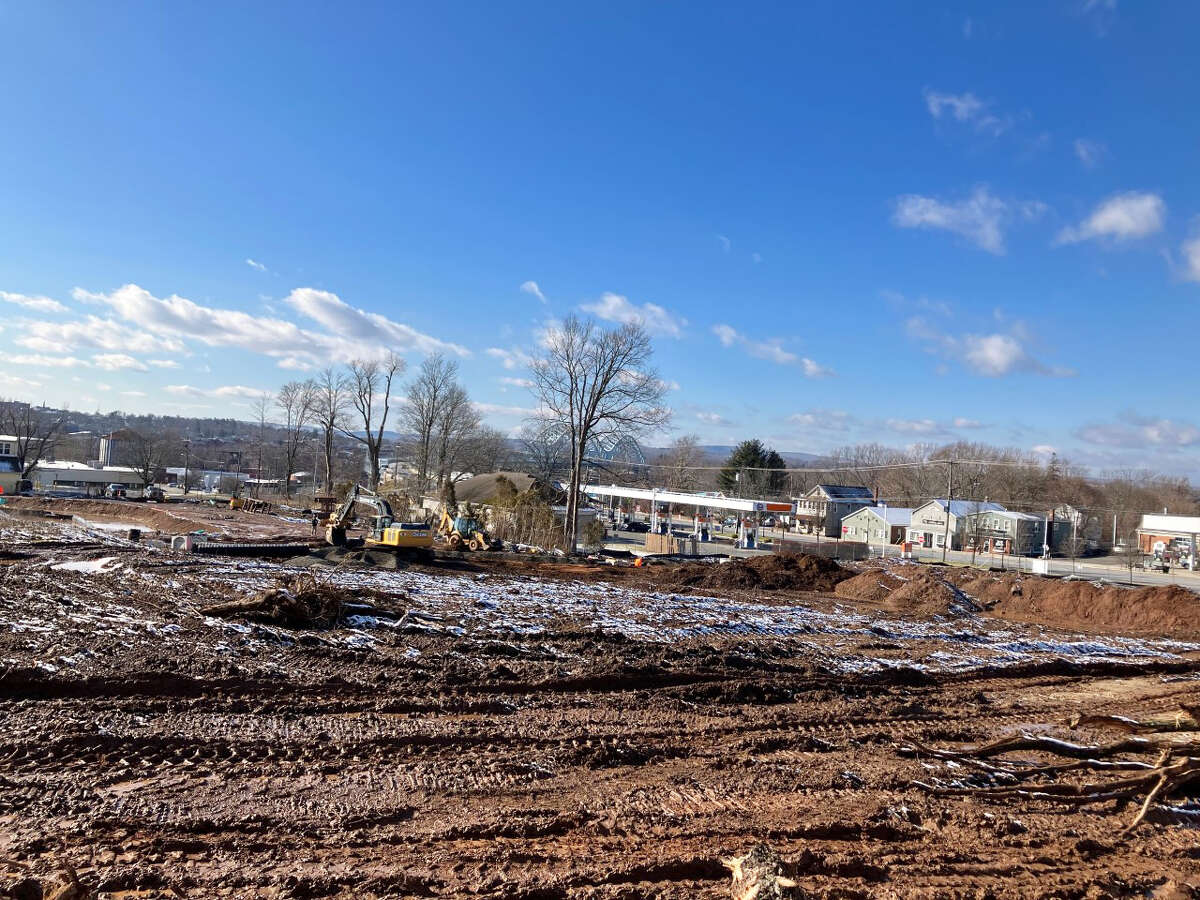 Despite pandemic-related issues delaying the first building at Brainerd Place in Portland, the developer says the mixed-use apartment, retail, medical and office development on the site of the closed Elmcrest Hospital near the Arrigoni Bridge remains on schedule. Shown is the excavation of Building E.