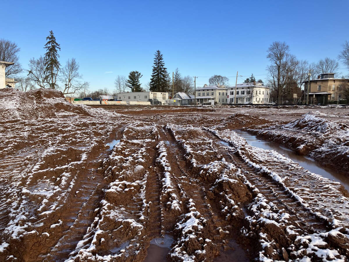 Despite pandemic-related issues delaying the first building at Brainerd Place in Portland, the developer says the mixed-use apartment, retail, medical and office development on the site of the closed Elmcrest Hospital near the Arrigoni Bridge remains on schedule. Shown is the excavation of Building E, which will be used for apartments,