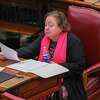 State Sen. Liz Kreuger wears a pink scarf to signify her support of an Equal Rights Amendment on Tuesday, Jan. 24, 2023, at the state Capitol in Albany, NY.