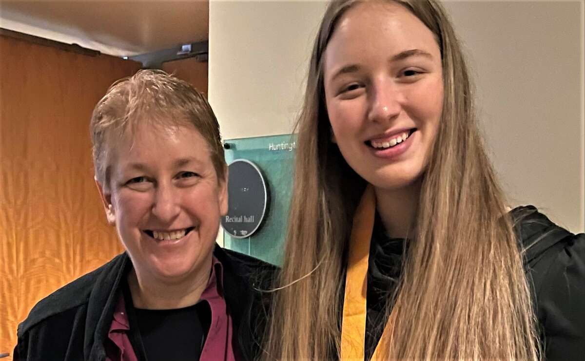 Andrea Mack (left), Manistee Area Public Schools director of bands, poses for a photo with Manistee High School senior Emily Sullivan at the Michigan Music Conference at the DeVos Center in Grand Rapids.