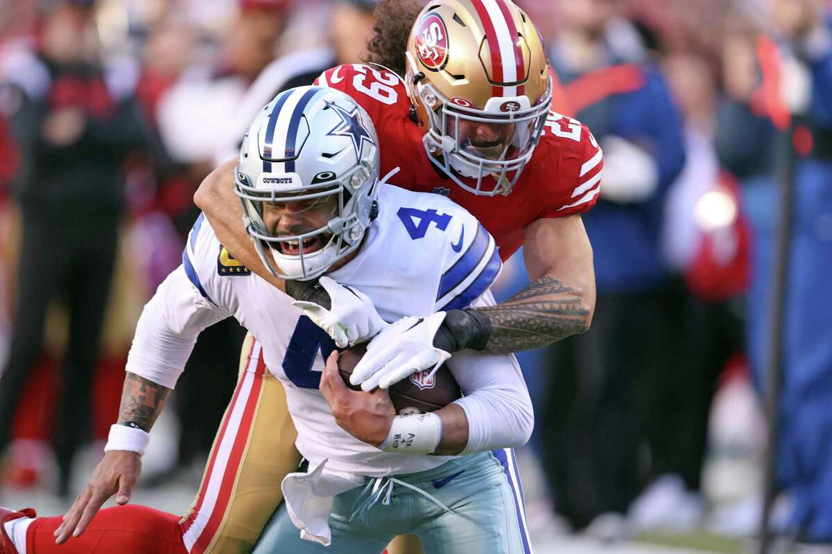 San Francisco 49ers’ Talanoa Hufanga tackles Dallas Cowboys’ Dak Prescott in 2nd quarter during NFC Divisional Playoff game in Santa Clara, Calif., on Sunday, January 22, 2023.