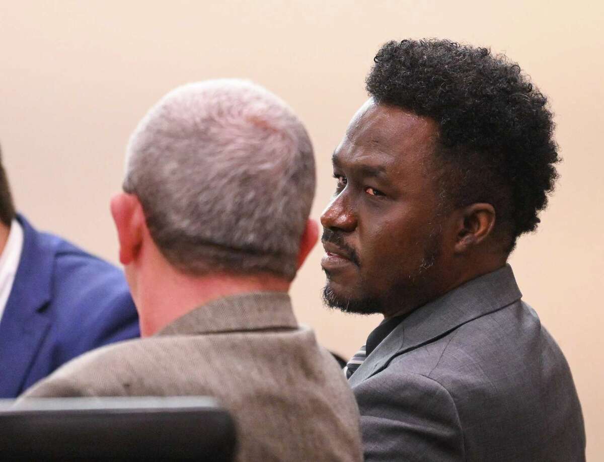 Andre McDonald speaks with his attorney, John Convery, during the second day of his murder trial in the 399th District Court on Tuesday. McDonald is accused of killing his wife, Andreen McDonald, in February 2019.