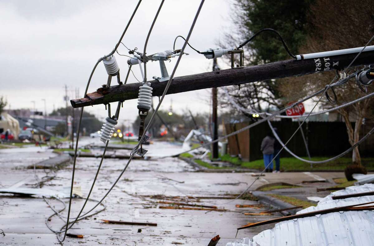 A downed power line where a tornado was reported to pass along Mickey Gilley Boulevard near Fairmont Parkway, Tuesday, Jan. 24, 2023, in Pasadena.