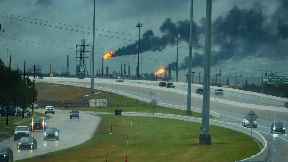 Flares burn at refineries east of the Sam Houston Parkway where a tornado was reported to pass along Mickey Gilley Boulevard near Fairmont Parkway, Tuesday, Jan. 24, 2023, in Pasadena.